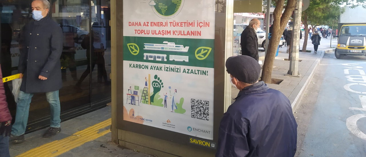 Man looking at poster with environmental message at a bus stop